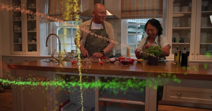Man chopping veg woman bringing herb pot trimming leaves gold sparks sweeping across prepping meal