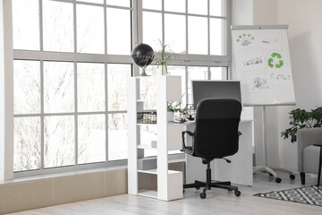 Sofa, modern workplace with computer and black swivel chair near window in room