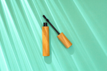 Black mascara on green background