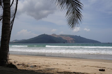 View of the hills from the edge of Mustika Beach, Banyuwangi during the day