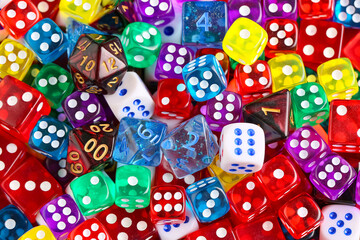 Different game dices as background, closeup