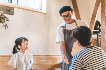 Wait staff and staff carrying food at cafes and restaurants, and customers
