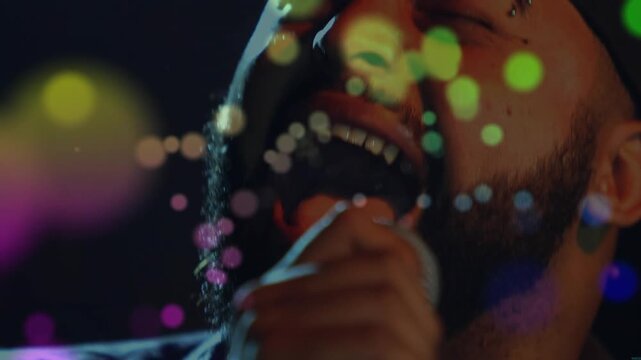 Recording cue starting, male singer singing for music production, bokeh dots drifting across mic