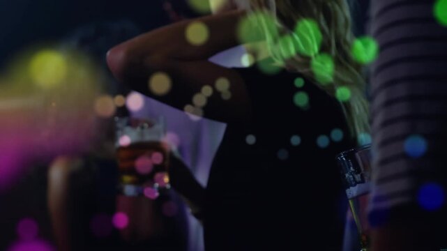 Camera pulling back, woman holding beer tucking hair revealing profile, club bokeh occluding faces