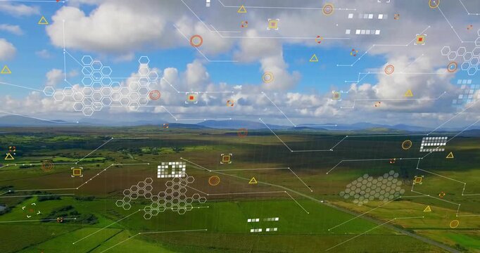 Data pulse sending translucent overlays across aerial farmland, hexagons and nodes mapping crops