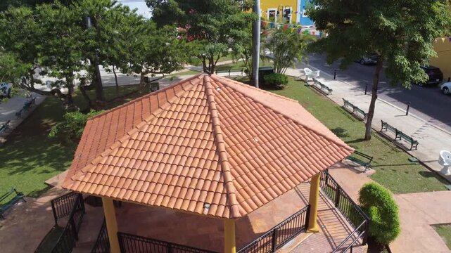 Aerial view of the tiled pavilion roof and gardens at Parque de La Ermita in M&eacute;rida, highlighting cultural heritage, colonial character, and the religious setting near the historic church.