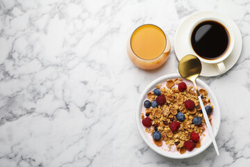Tasty breakfast. Granola with yogurt and fruits served on white marble table, flat lay. Space for text