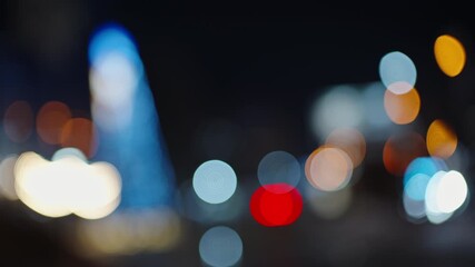 Defocused night city street scene with colorful bokeh lights and orbs, capturing an abstract urban atmosphere as festive illumination shimmers in a dreamy, cinematic blur - Powered by Adobe