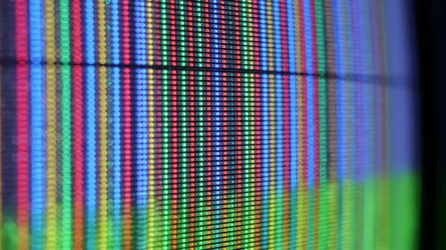Extreme Close Up of RGB Subpixels on an Old CRT Screen Emitting a Vibrant Glow in a Macro View