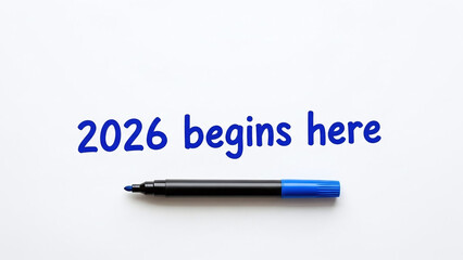 blue marker 2026 text clean studio layout. Minimal top-down studio layout with blue marker and 2026 text. Blue marker with 2026 text on white background. Starting 2026 with a clear fresh focus. 