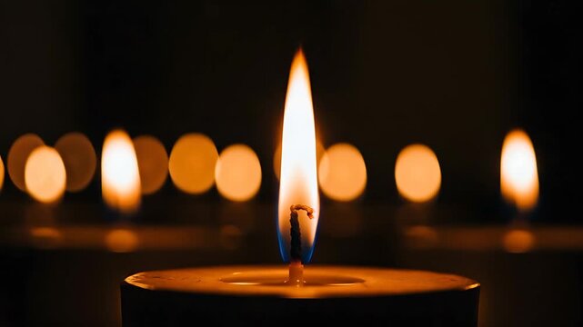 Warm Candlelight Flickering in the Darkness: A Serene and Reflective Ambiance with Bokeh