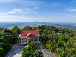 A peaceful view of the temple roof at Phu Ang So monastery, located on the 695-meter summit of Phu Pha Lek. Captures calm spiritual architecture and natural mountain scenery.