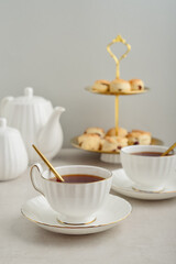English Afternoon Tea  in elegant white porcelain cups
