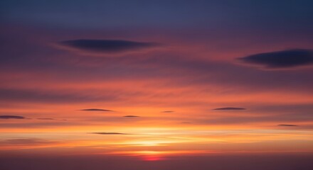 Fototapeta premium Sunset Glow Majestic Sky Painted with Fiery Hues and Clouds at Dusk