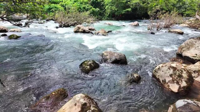 Superb view of summer: Slow motion of the fantastic Moot valley in Phong Nha National Park, Vietnam with the sound of a clear stream flowing through the peaceful tropical jungle