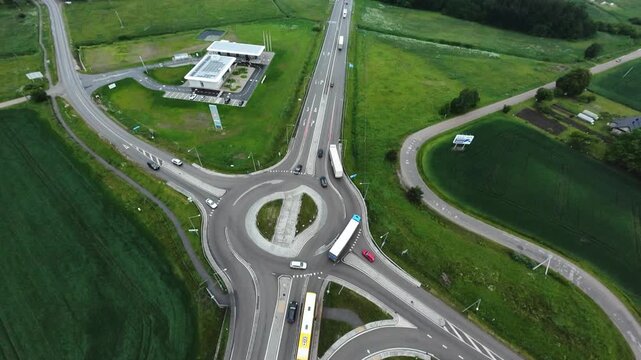 unmanned aerial photograph showcasing ecofriendly transportation and habitat boundaries, unmanned camera reveals agricultural scene with ecological considerations and traffic patterns