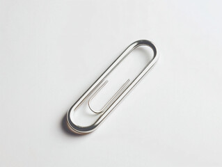 Metallic Paperclip on White Surface for Office and School Use