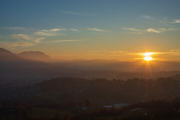 Dreamlike sunset over Bosnian hills outside Sarajevo, vivid tones and minimal horizon for modern design projects.