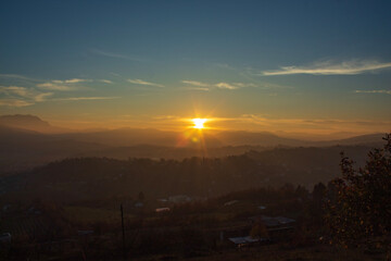 Dreamlike sunset over Bosnian hills outside Sarajevo, vivid tones and minimal horizon for modern design projects.