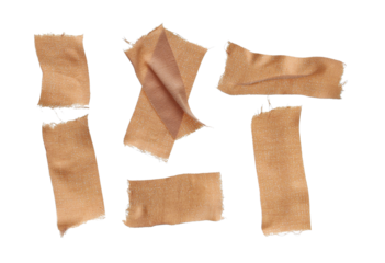 close up photograph of six torn, rustic, flesh-colored woven fabric bandages with frayed edges scattered randomly on a deep transparent background.