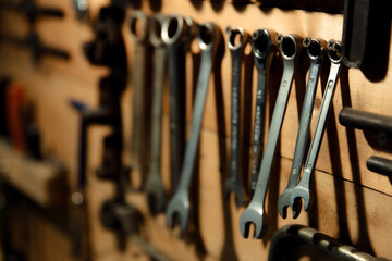 Workbench with hand tools on a wooden base. Garage workstation for classic car repair. Father's Day...