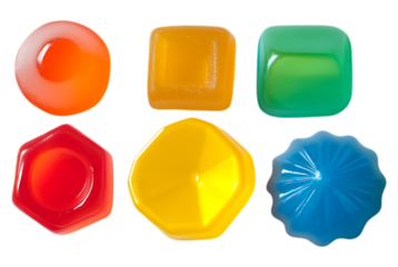 collection of six vibrant, glossy, and translucent jelly or gummy candy pieces in various geometric and molded shapes, isolated on a stark transparent background.