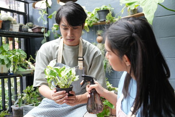 The couple takes care of the plants together, gardening in front of the house, fertilising and watering them