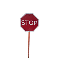 A red stop sign with white border and the word stop on a pole against black background