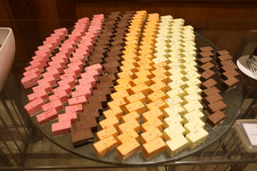 multi colour cheese cake on display 