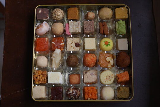 multicolored variety of indian sweets from different parts of the  states