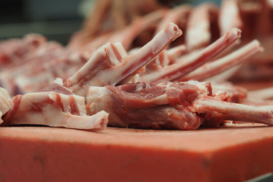 Fresh lamb chops ready for sale in a market stall