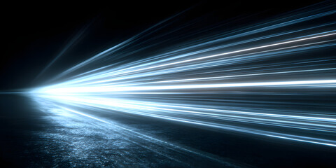 Neon blue motion light trails over black background. Abstract speed effect. Rays of light moving fast over dark background