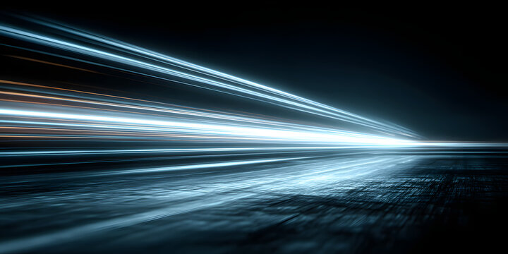 Neon blue motion light trails over black background. Abstract speed effect. Rays of light moving fast over dark background