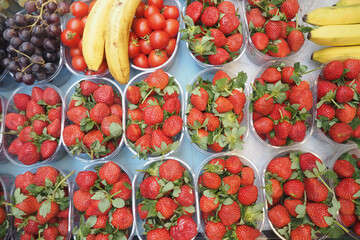 Fresh fruits displayed at a market in bright, vibrant colors