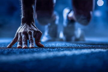 Ready to launch a new venture? Athlete poised at the starting line embodies ambition, determination, and the thrill of the chase in a cool, moody setting