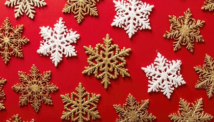 Festive Christmas Snowflake Decorations Scattered on Vibrant Red Background.