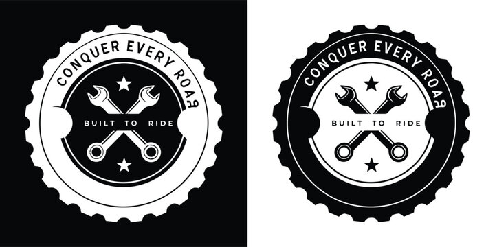 A circular emblem with the text conquer every road, featuring crossed wrenches and stars, suitable for automotive or adventure themes, in black and white
