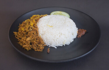 indonesia homemade cuisine named nasi krawu - a warm rice with seasoned shredded beef and shredded coconut meat
