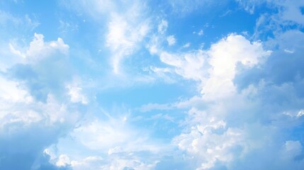 Fototapeta premium Dreamy pastel sky with soft wispy clouds — serene blue and white cloudscape, ethereal atmospheric background for wallpaper, banner, web design and nature-themed projects