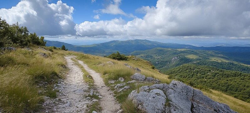 Panoramic mountain vista with a trail - Powered by Adobe