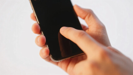 A close-up of hands operating a smartphone. Everyday scenes. Electronic device.