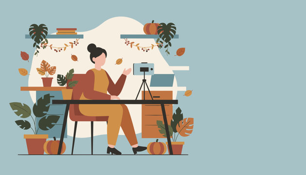 Autumn Vlogger Woman recording video content at a festive home desk setup Work from home concept