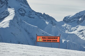 Ski warning sign for lack of snow, thin snow cover