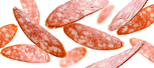 Sausage slices levitate on a white background