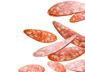 Sausage slices levitate on a white background