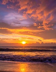 Ocean sunset with vibrant orange, yellow, purple sky reflection