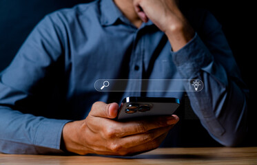 Person Holding Smartphone with Search and Alert Icons Displayed on Screen, Representing Technology and Modern Communication Concepts in Dark Environment