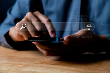 Close-up of a person's hands using a smartphone to browse online search results with an emphasis on technology and digital searching concepts