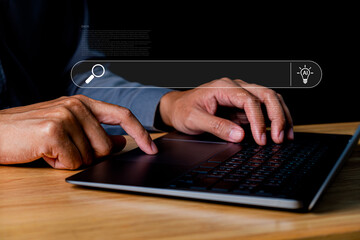 Hands Typing on Laptop with Search Bar Display Illustrating AI Technology and Data Exploration Concept in Dark Environment