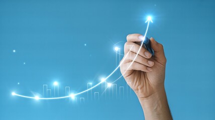 A hand draws a glowing upward arrow on a blue background, symbolizing business growth and success in the financial market.